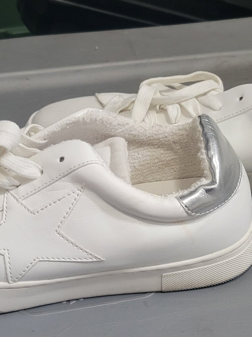Steven brand white fashion sneakers with star on the side and silver back chucks